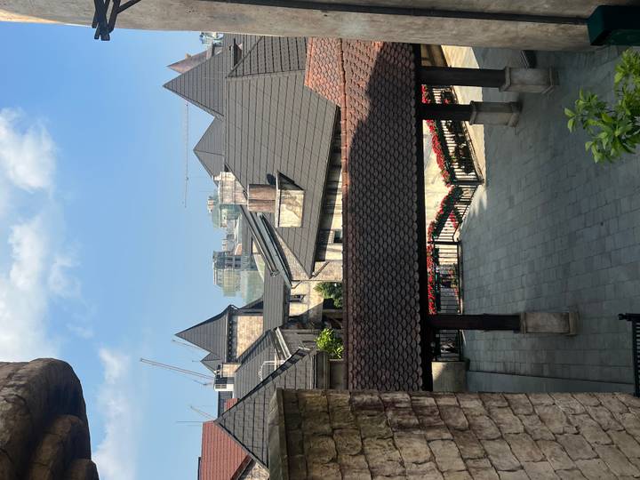 Rooftops of a European-style village street at Ba Na Hills under blue skies.