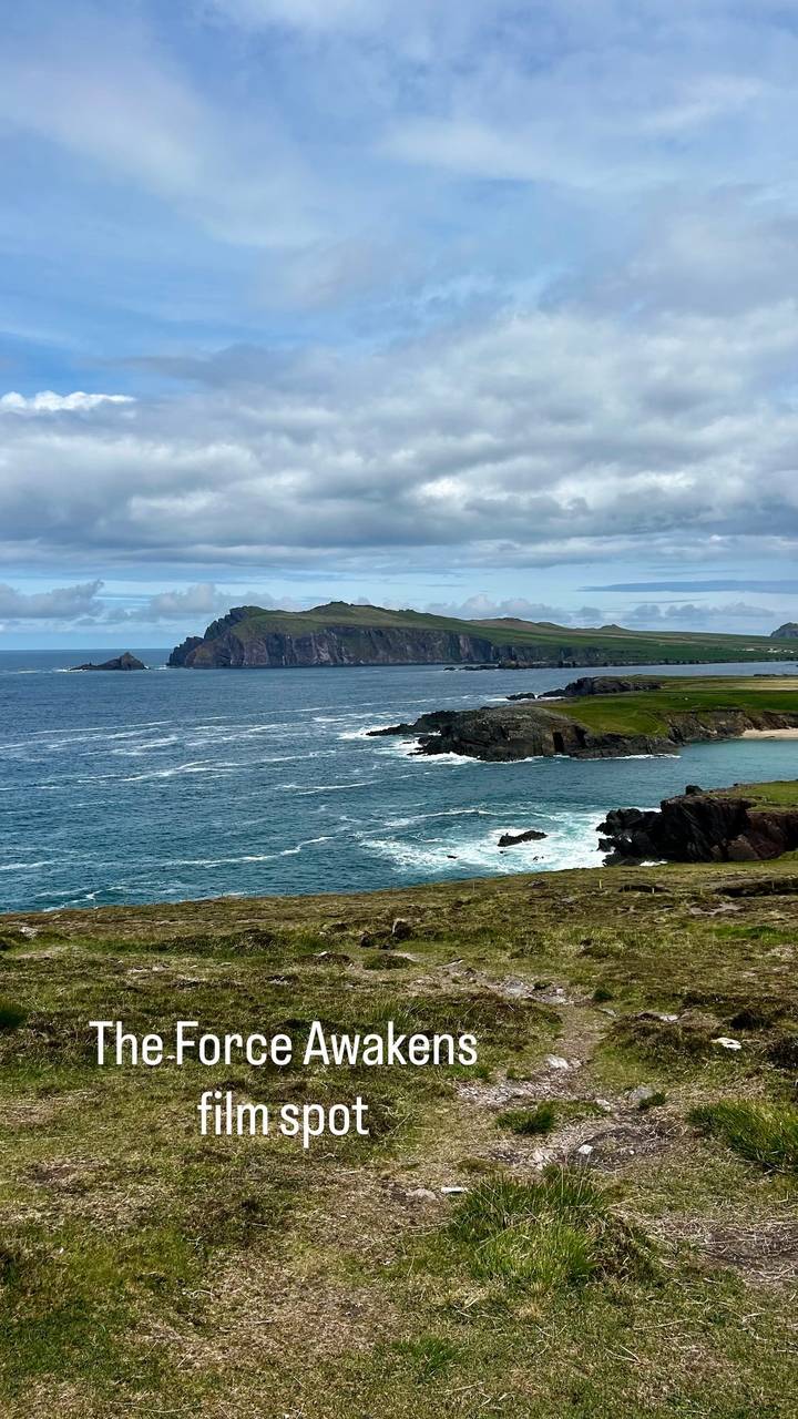 Dramatic Atlantic coastline of the Dingle Peninsula with headlands and rolling surf under broken clouds