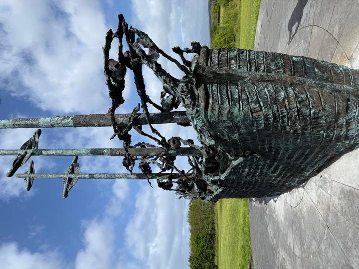 The bronze 'Coffin Ship' famine memorial sculpture depicts gaunt figures entwined with a sailing vessel.