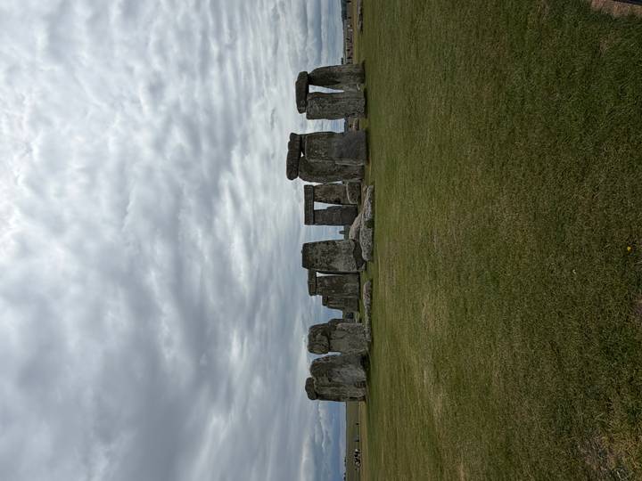 Iconic stone circle of Stonehenge under a dramatic cloudy sky