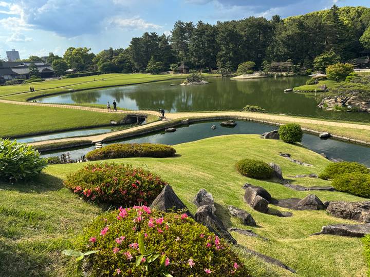 Beautiful landscaped Japanese garden with ponds, curving bridges and flowering shrubs
