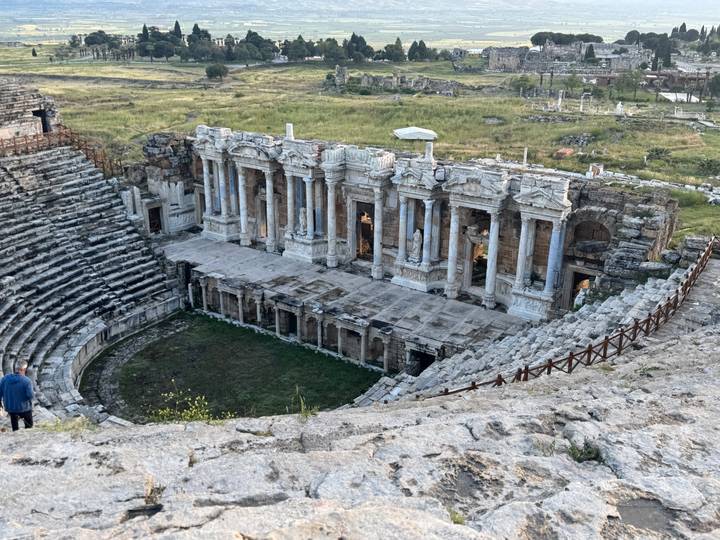 Well-preserved ancient Roman theatre at Hierapolis with tiered seating and ornate stage