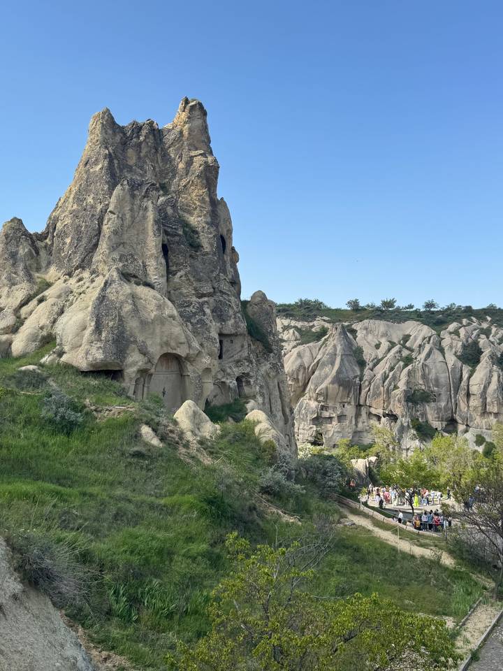 Rocky fairy-chimney formations with ancient cave dwellings in Cappadocia