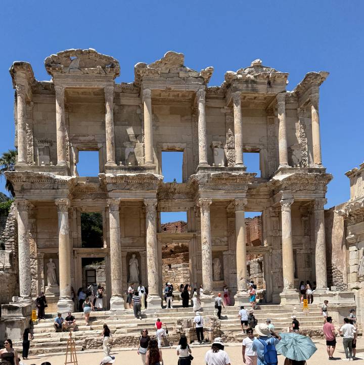 Close-up of the ornate multi-storey façade of the Library of Celsus under clear skies.