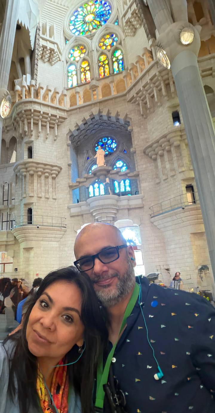 Selfie inside a monumental church with stained glass windows and stone arches