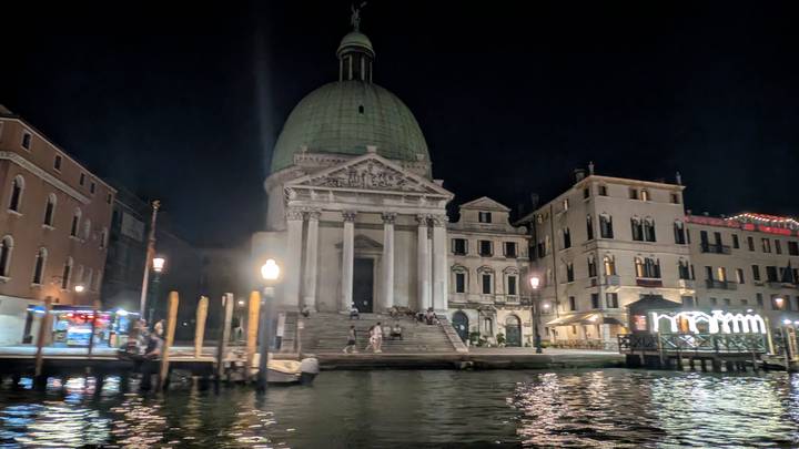 Nighttime view of San Simeone Piccolo church lit along Venice's Grand Canal