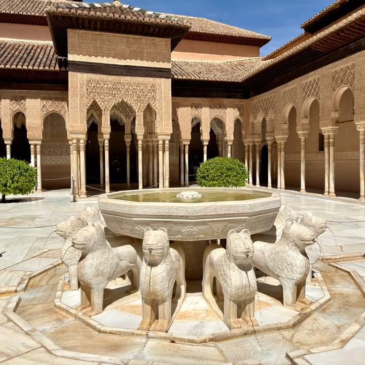 Iconic Lion Fountain centred in the marble courtyard of the Alhambra.