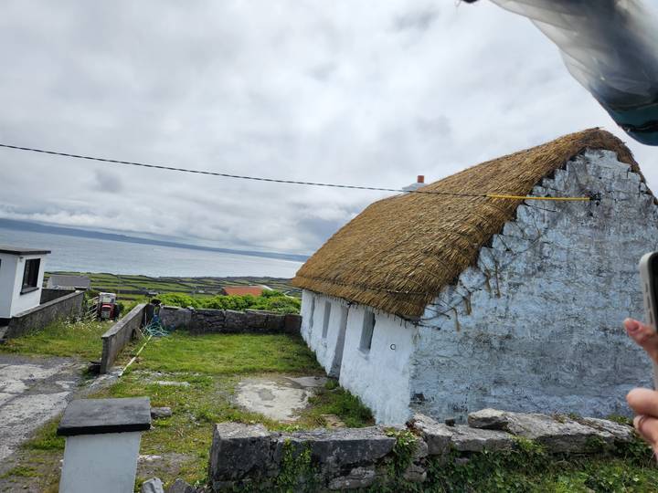 Traditional whitewashed thatched cottage overlooking the Atlantic on Inisheer Island.