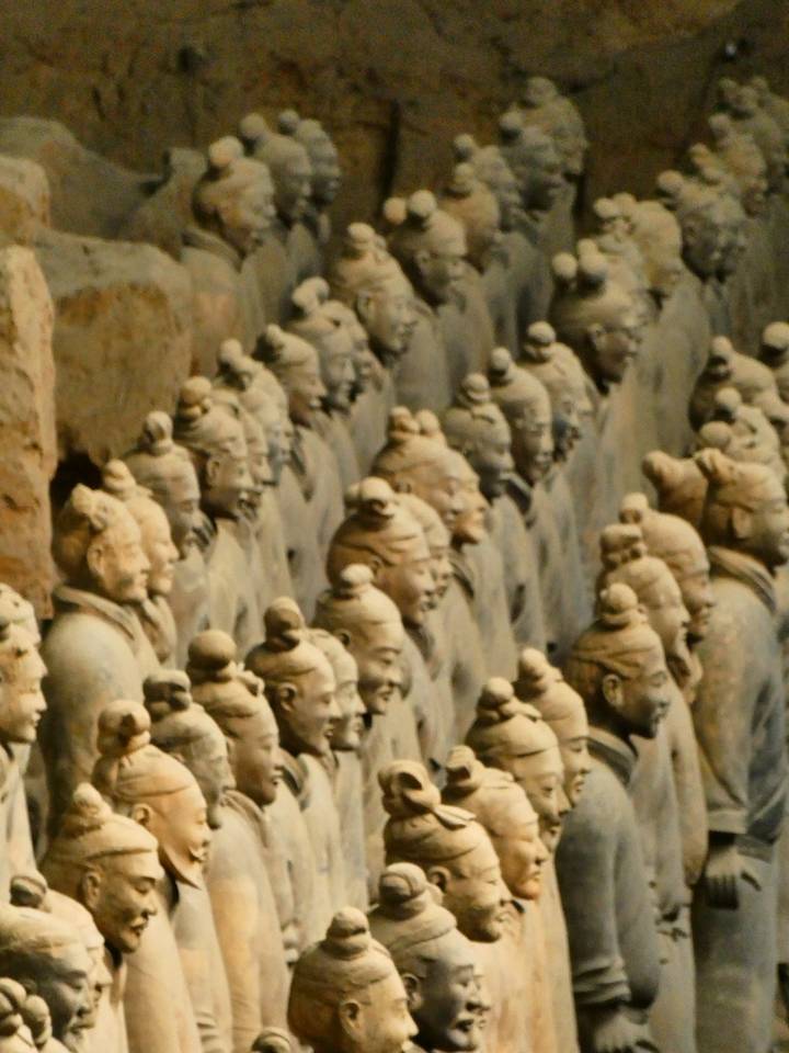 Row upon row of Terracotta Warrior figures captured in a slightly soft, grainy image.