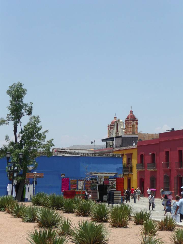 Colonial church domes rise above colorful rooftops in Oaxaca’s historic center.