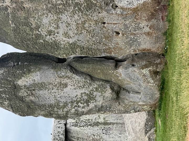 Close view of weathered sarsen stone showing lichen and texture at Stonehenge.