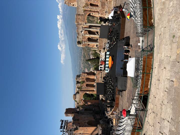Ancient Greek Theatre of Taormina with stage set and Mount Etna in background