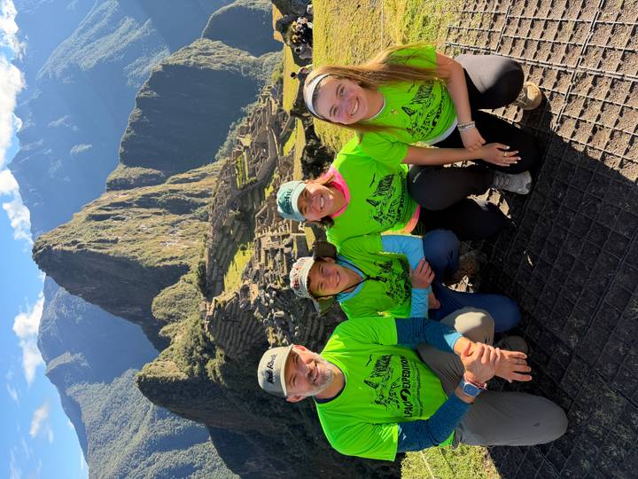 Family portrait with awe-inspiring view of Machu Picchu citadel and Huayna Picchu mountain