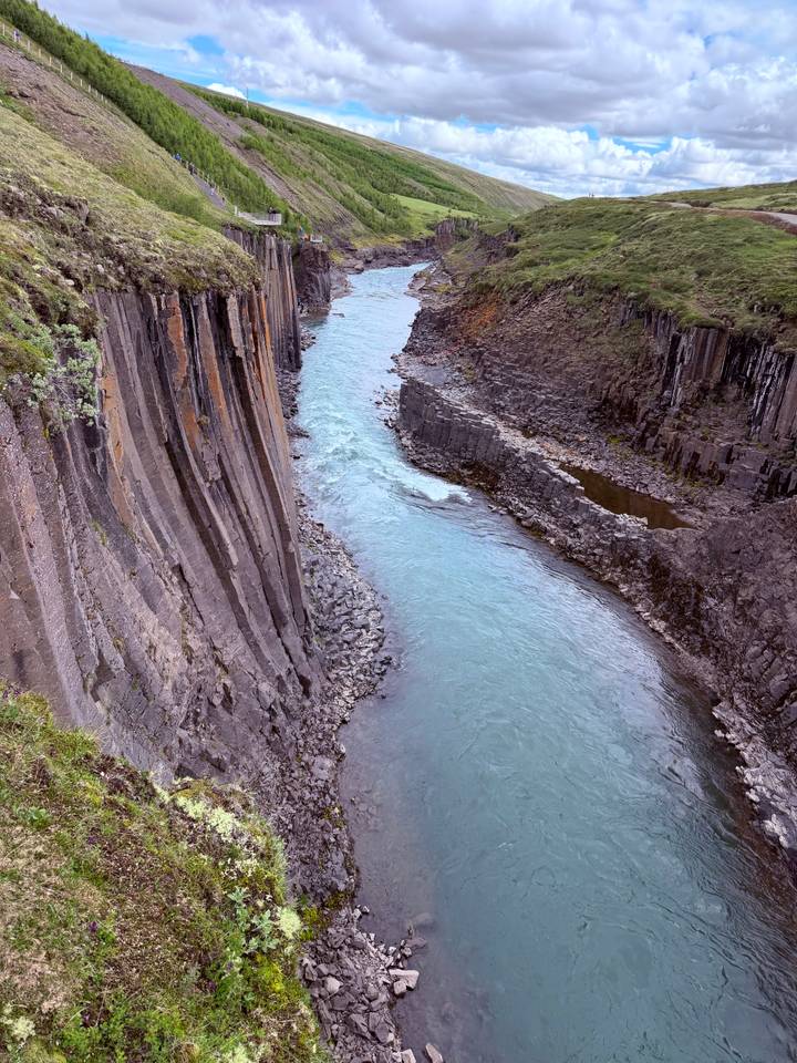 Scenic view of a deep basalt canyon with a blue river winding between sheer rock walls