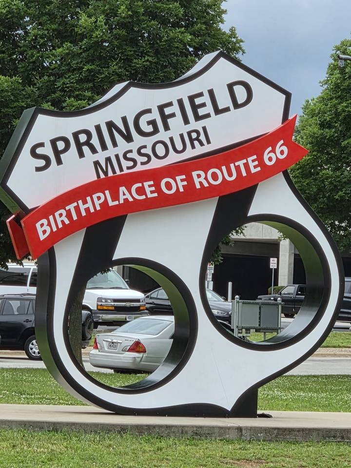 Large roadside sign proclaiming Springfield, Missouri as the birthplace of Route 66.