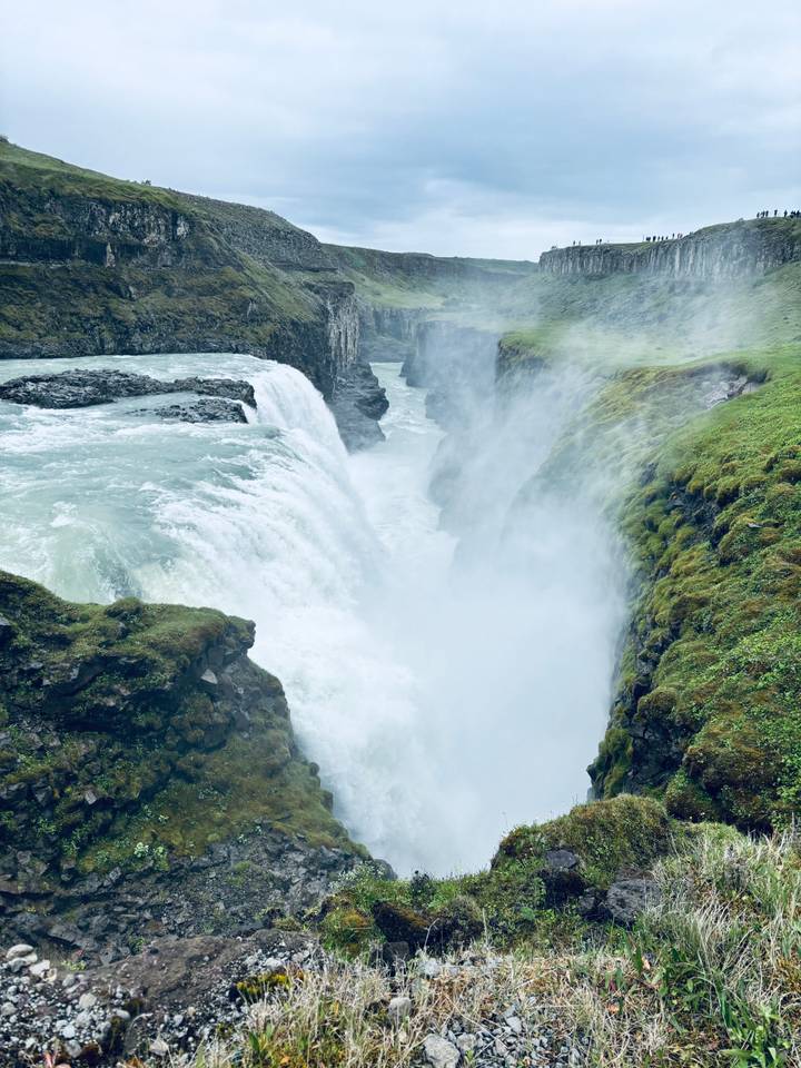 Powerful river thundering through the misty canyon of Gullfoss waterfall.