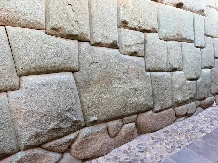 Detail of perfectly fitted twelve-angled Inca stones forming an ancient Cusco wall.