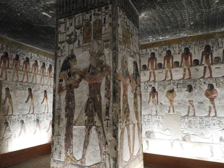 Colorful hieroglyphic murals covering walls inside a pharaoh's tomb in the Valley of the Kings