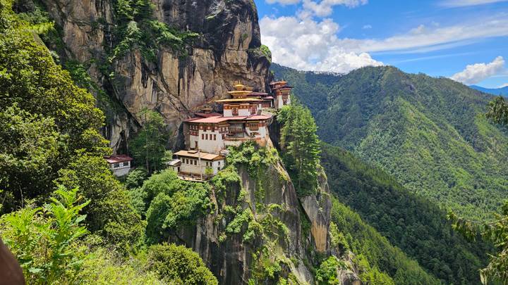 Tiger's Nest Monastery perched high above a verdant valley on a sunny day