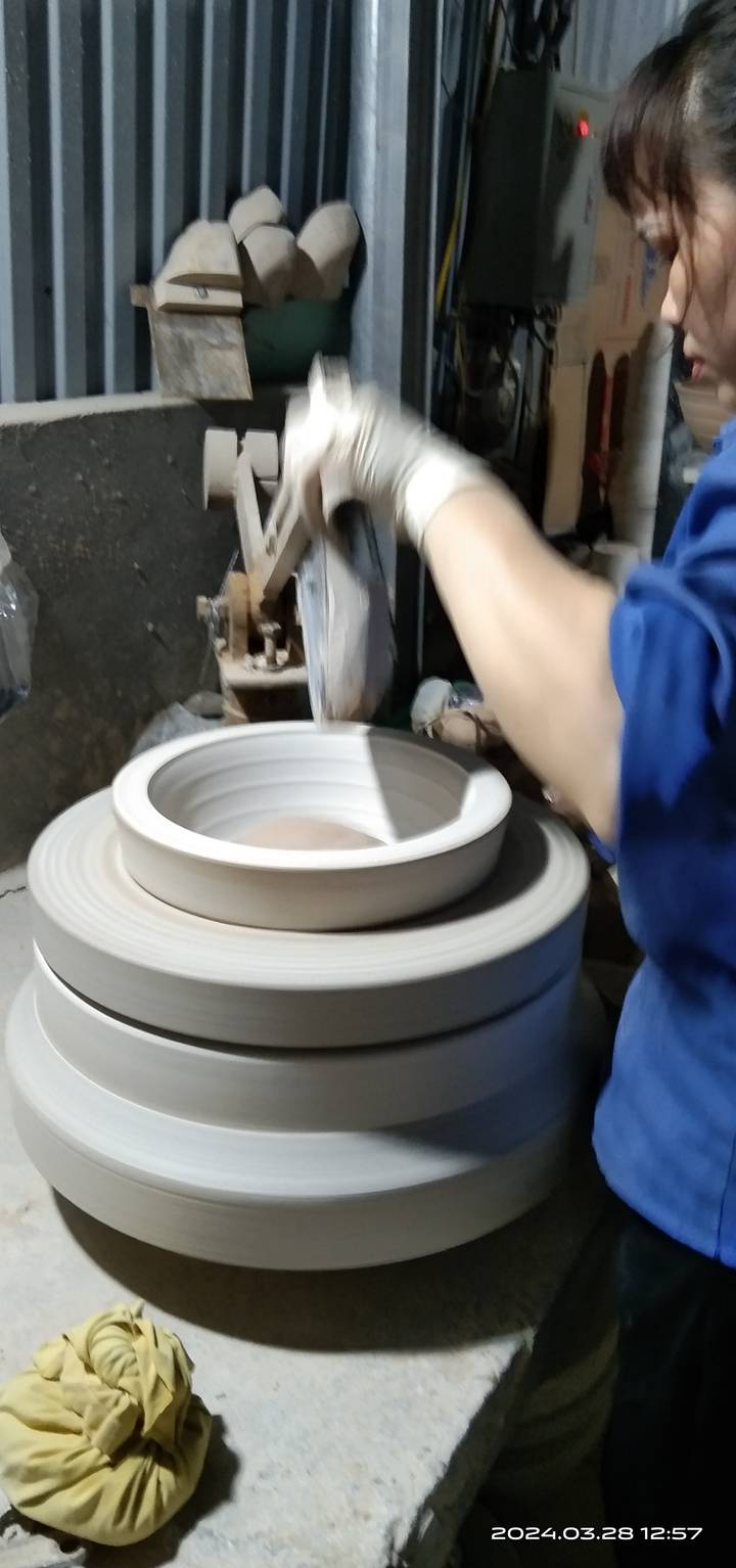 Blurry close-up of a pottery wheel in motion during a ceramics workshop.