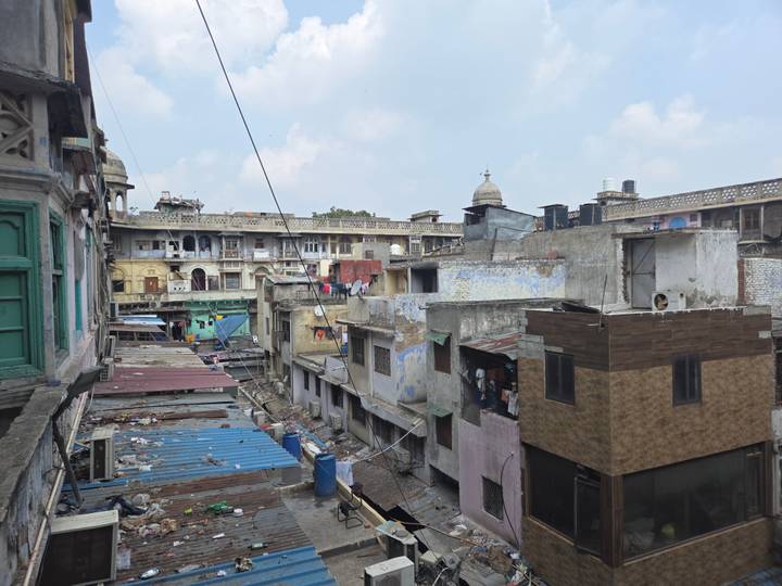 Urban view of tightly packed historic buildings and rooftops in an old Indian neighborhood