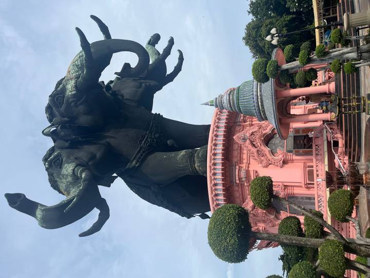 Gigantic three-headed elephant statue atop a pink ornate base at the Erawan Museum