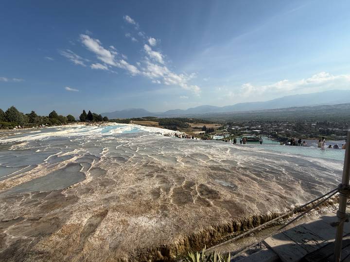Expansive travertine terraces of Pamukkale crowded with visitors