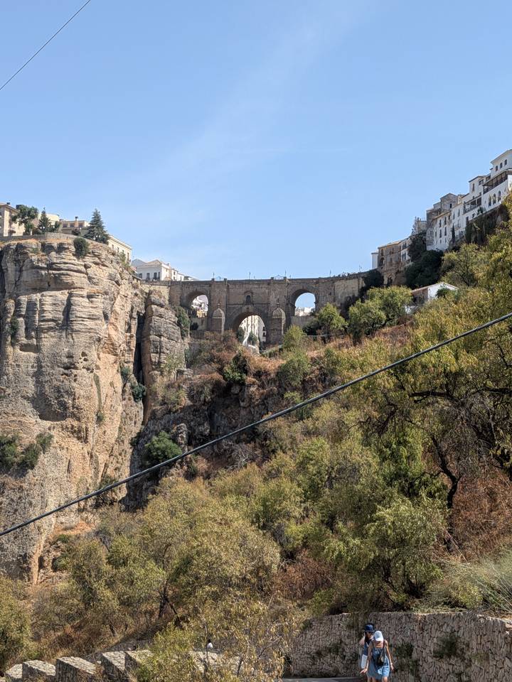 The Puente Nuevo stone bridge spans Ronda’s dramatic gorge amid rugged cliffs and hillside homes.