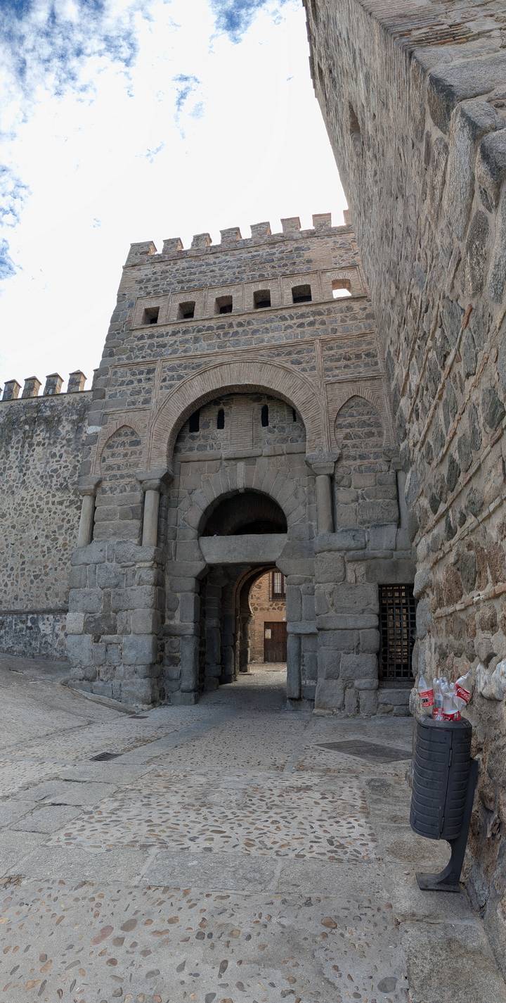 Ancient stone gate with Moorish arches and heavy blocks forming part of Toledo’s historic walls.