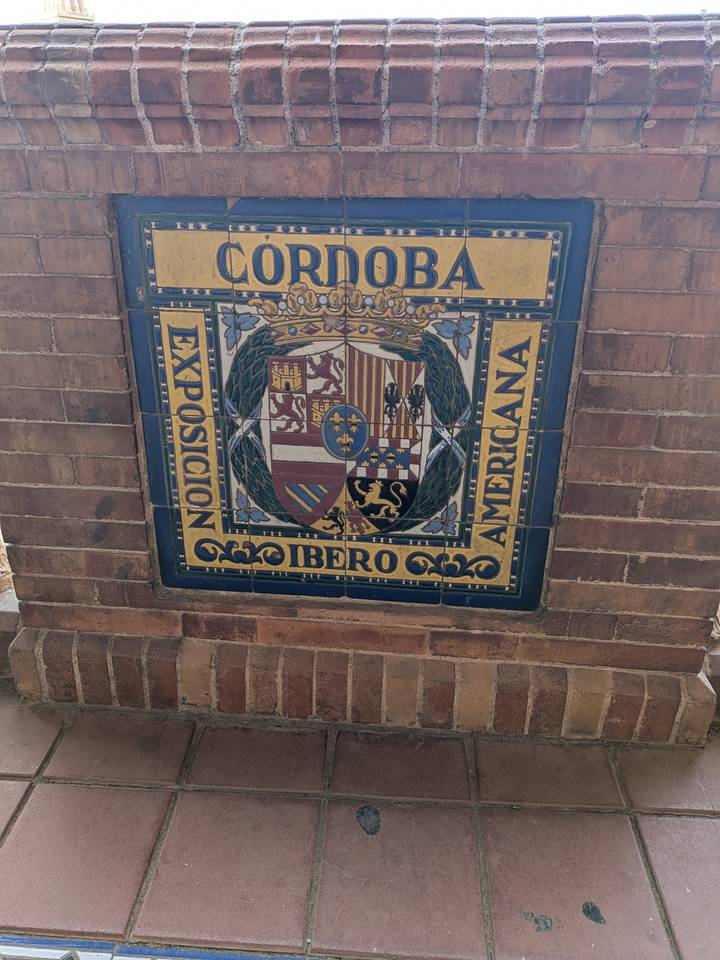 Colorful ceramic tile panel showing the coat of arms for the 1929 Ibero-American Exposition.
