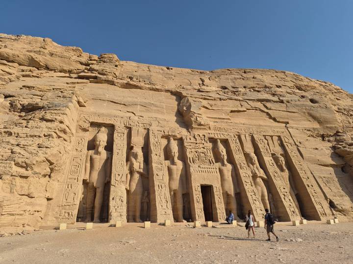 Rock-hewn façade of the Small Temple at Abu Simbel bathed in afternoon light.