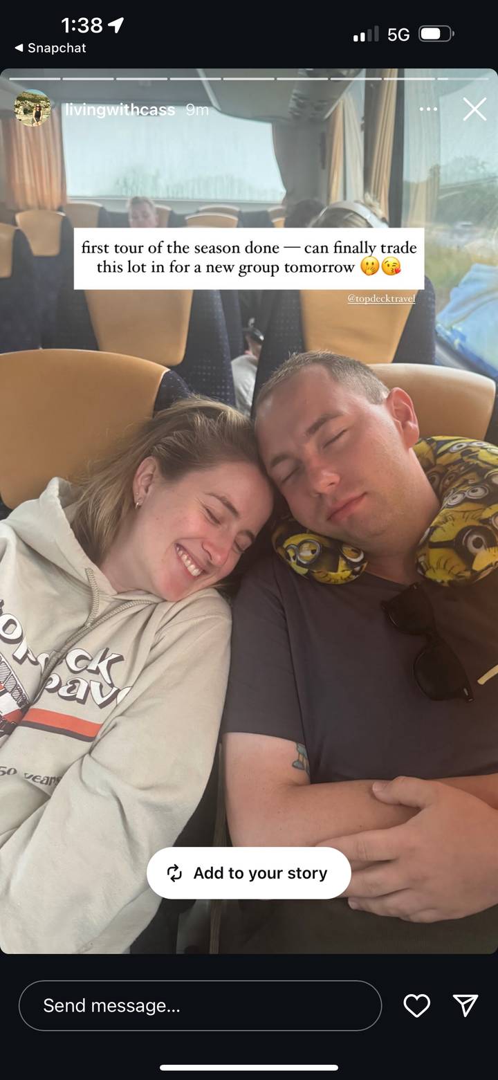 Close-up of two travelers sleeping against each other on transport seats.