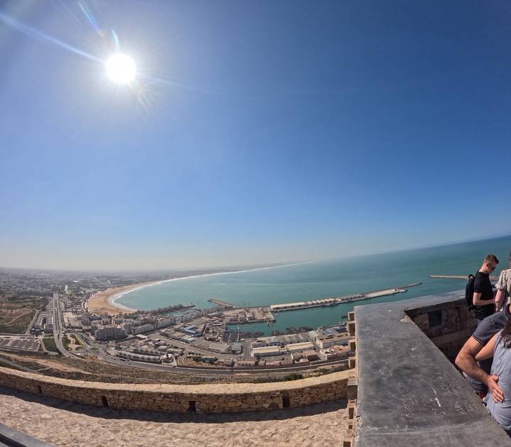 Sweeping view over Agadir's curved beach, port and cityscape from a hilltop kasbah viewpoint