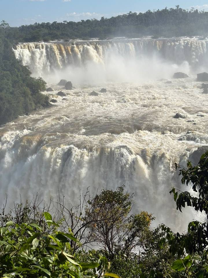 Close view of turbulent brown waters plunging over Iguazu Falls.