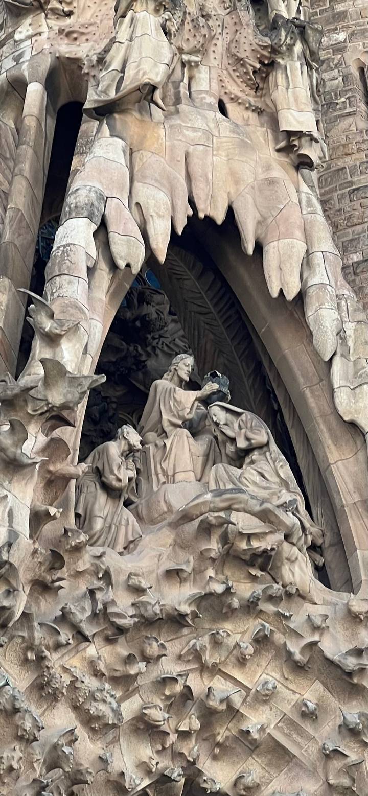 Stone sculptural group on the Nativity façade of the Sagrada Familia.