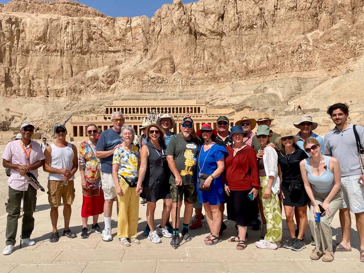 Tourists gather for a photo at the spectacular rock-cut Temple of Hatshepsut.