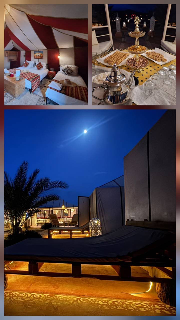 Night desert camp scene with full moon shining above canvas tents and a palm silhouette