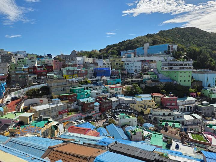 Colorful hillside houses of Gamcheon Culture Village sprawling below green mountains