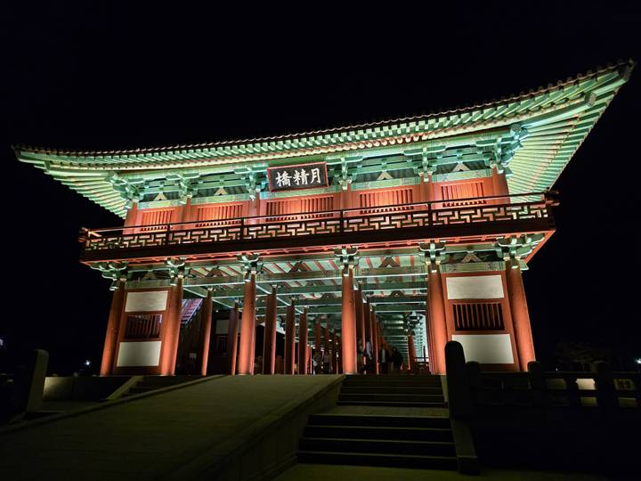 Beautifully illuminated traditional wooden bridge at night in Gyeongju