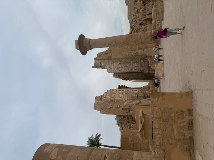 Towering columns and obelisk remnants of Karnak Temple dominate the ancient courtyard.