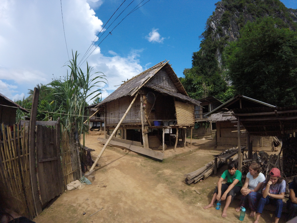 Traditional huts in a rural setting.
