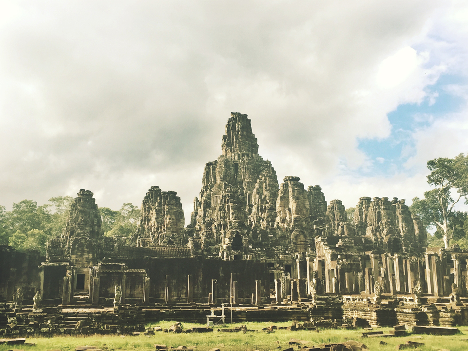 Ancient stone temple ruins with bright sky.