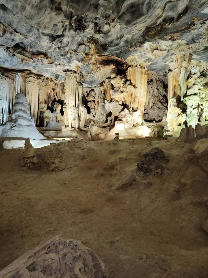 Interior of a rock cave with stalagmites.