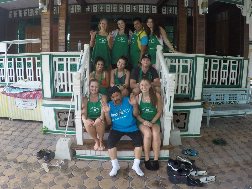 Group photo on a staircase with cheerful expressions.