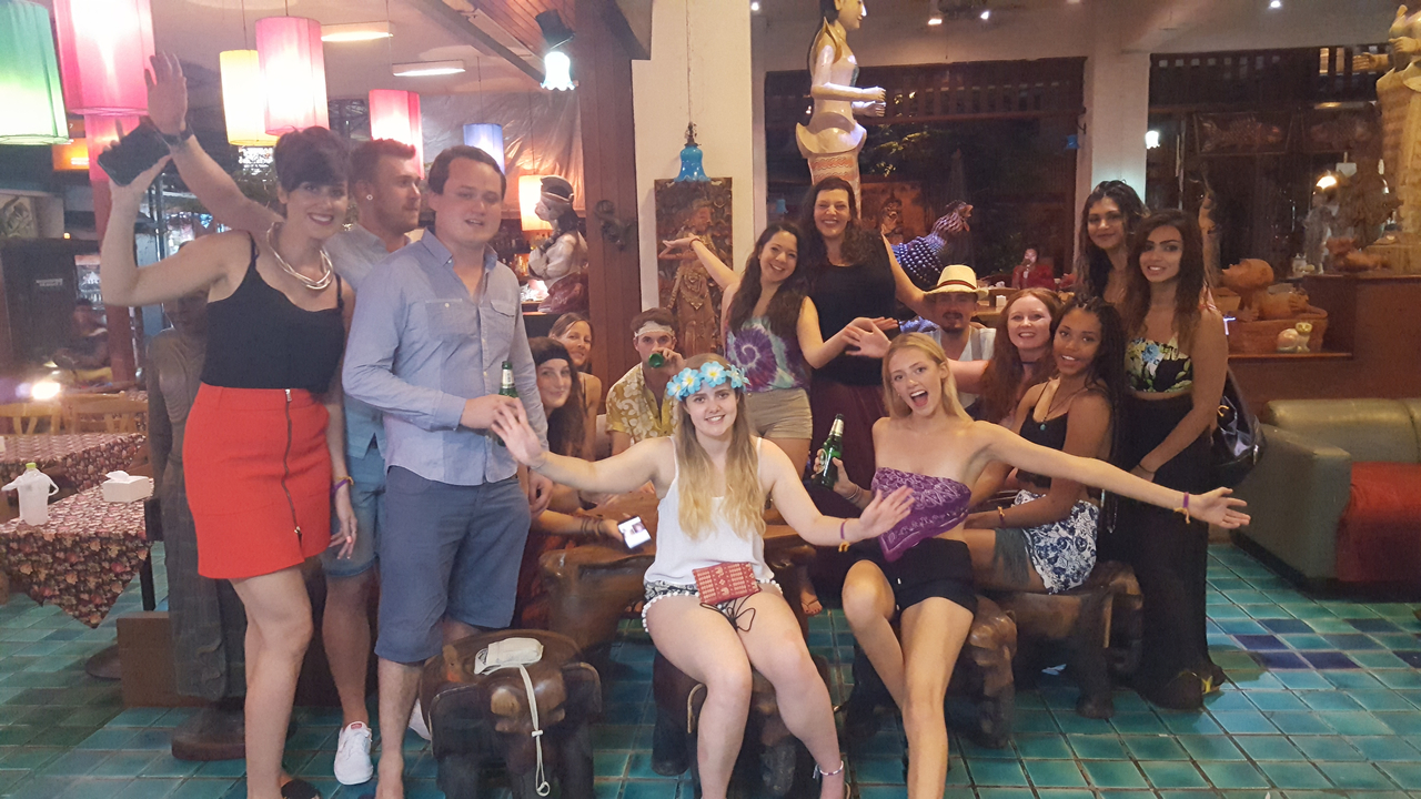 Group of people partying inside a venue.