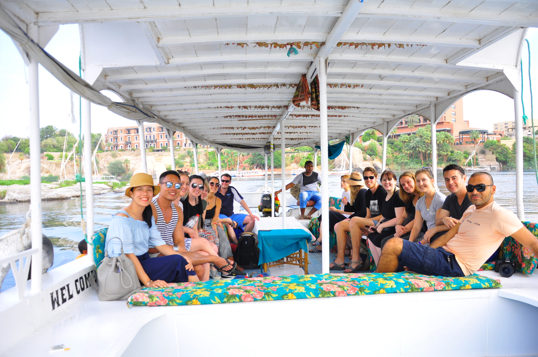 Group touring a river or canal on a boat.