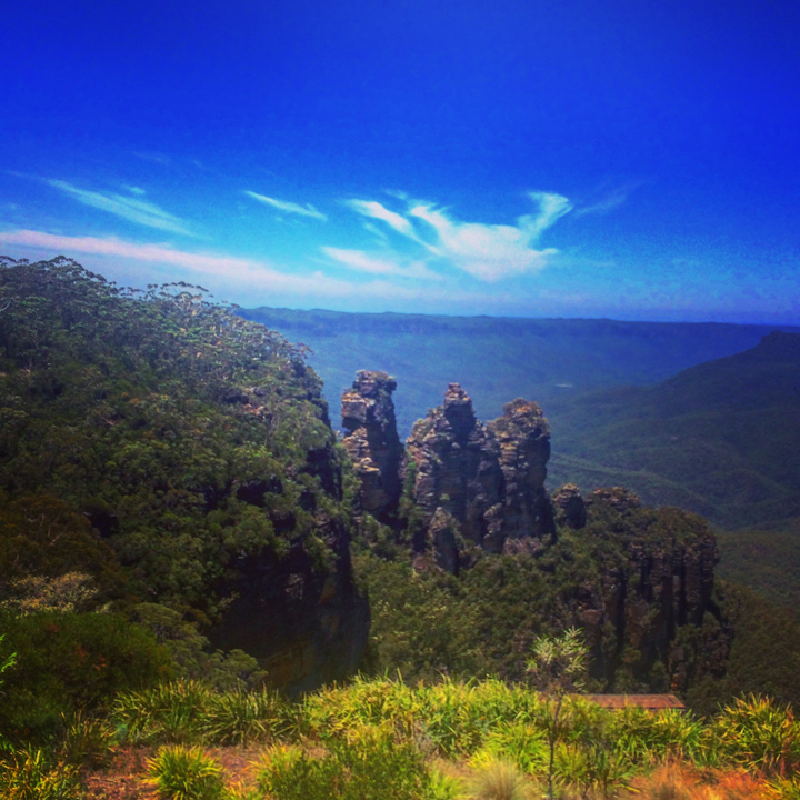 A scenic view of a mountain range with lush greenery.