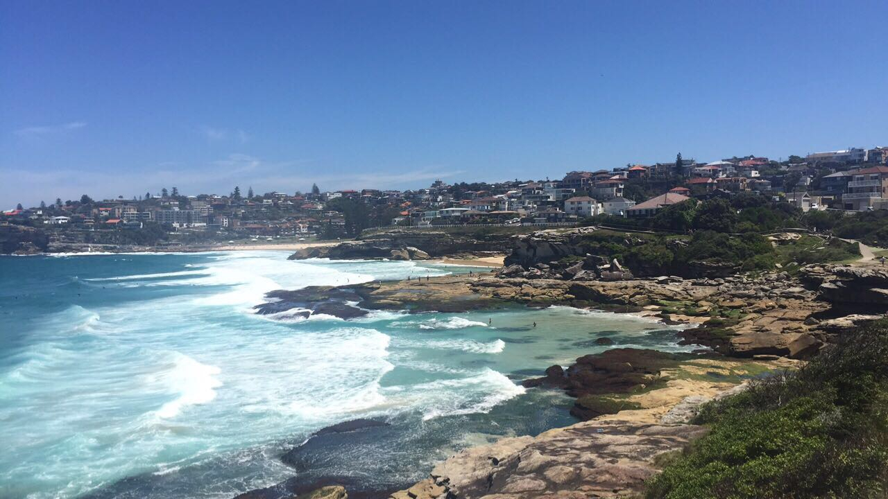 Coastal view with waves crashing on rocks