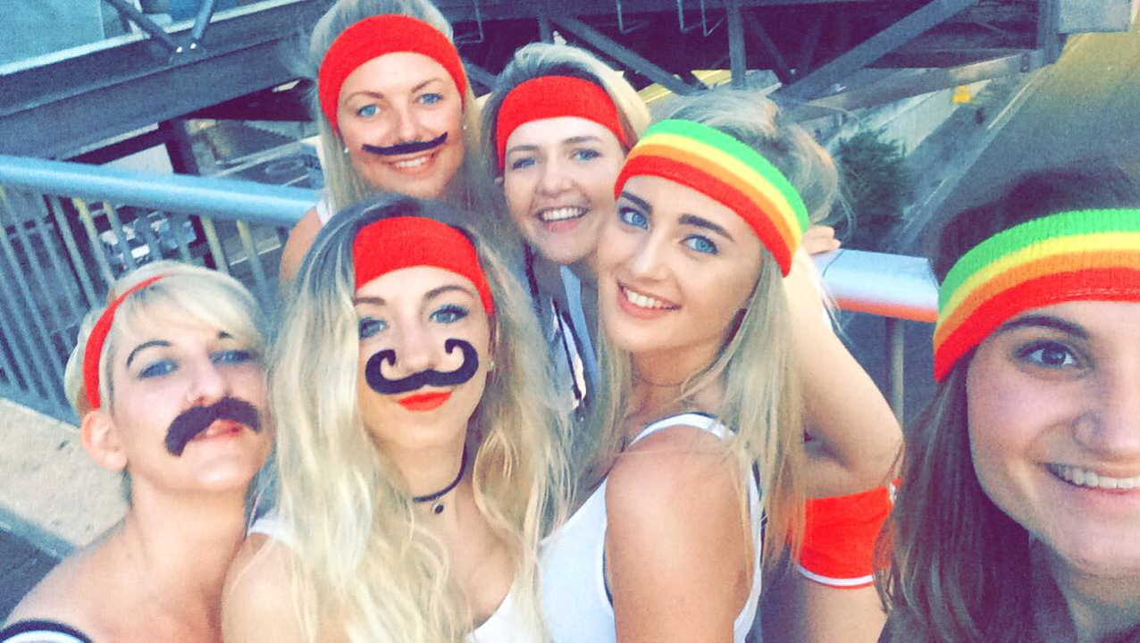 Group photo with friends wearing colorful headbands