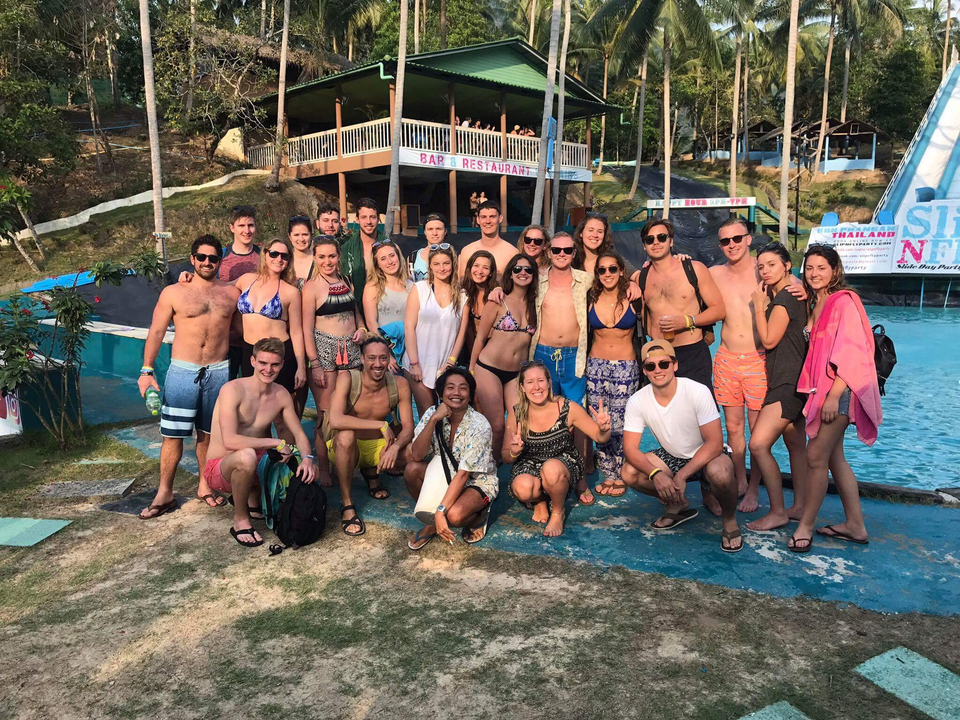 Large group of people at a beachside restaurant.